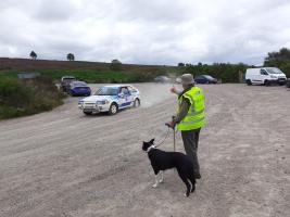 Rotarian Alex Bowes waves to one of the drivers arriving at the stage at Fetteresso Forest.